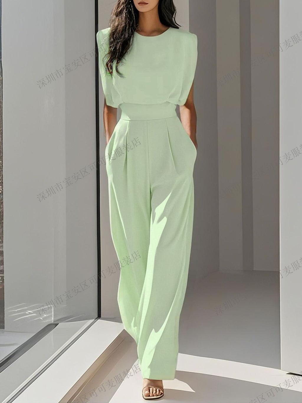 A solid color waist-cinching and slimming jumpsuit with a sophisticated and elegant feminine style