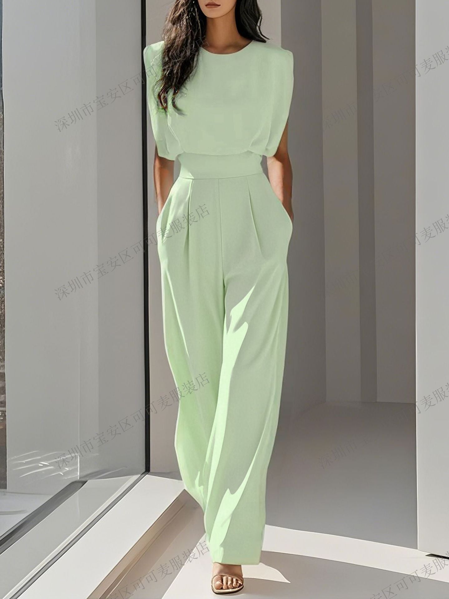 A solid color waist-cinching and slimming jumpsuit with a sophisticated and elegant feminine style
